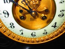 Detail of 19th c. black marble French clock with mercury pendulum by Moulin St. Etienne