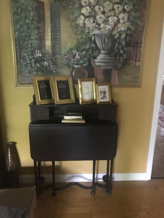 Small antique desk. Folds close to the wall. 