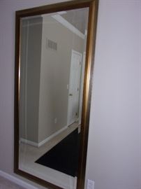Large floor to ceiling mirror with beveled edge in workout room great for entry piece or statement piece in any room!