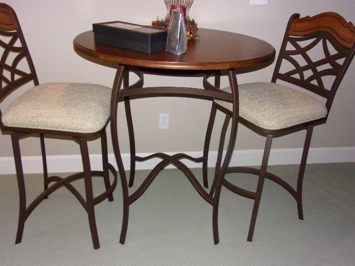 Pub height table and four swivel bar stools(2 are at the bar)