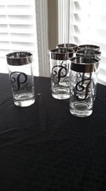 Pretty silver rimmed glasses monogrammed with the letter "P".