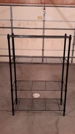 Black metal shelving, 53" tall. There are 4 shelves available.
