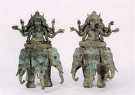 Pair of antique Hindu Bronzes of Lord Ganesha, god of wisdom, luck and success, 19th C. The elephant god with three heads, rides on a three-headed elephant and holds a small elephant in each of his 6 arms