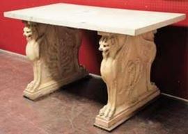 Center Hall or Library Table composed of Terracotta Griffon pedestals supporting a marble slab.