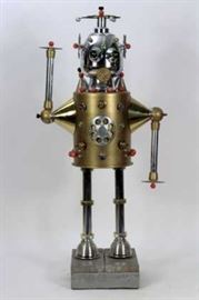 Steampunk Female Robot, aka “Millie”, life-sized, mixed metal and plastics, signed R. Wheeler 2006. Her arms rotate, antennae and ears rotate, appears to be adaptable to internal lighting. Please see her male friend "Tillie" elsewhere in this auction