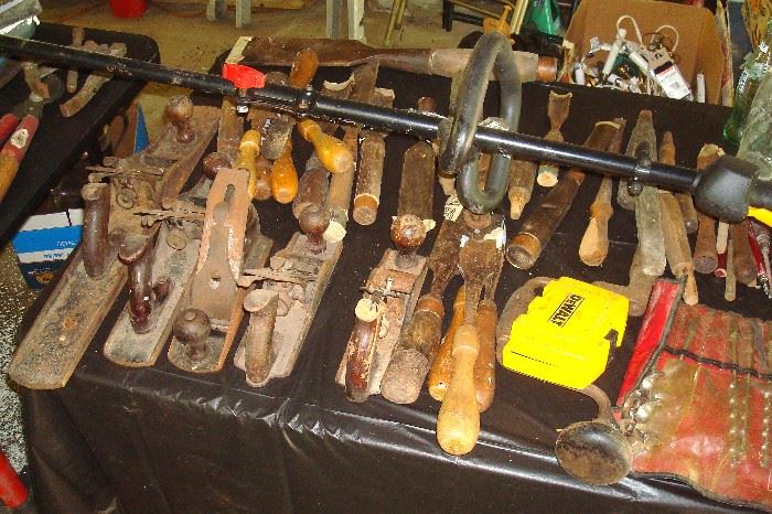 Old planes and carving & turning chisels. Also, partly shown a new high extension chain saw for high limbs.