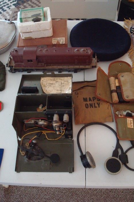 WW 2 Morse code transmitter, old Lionel train engine & other military items.