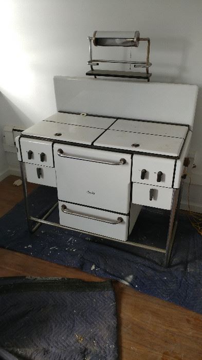 Fabulous, white enamel and chrome gas stove with Bakelite knobs