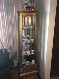 Curio Cabinet wood and glass with a large collection of teacups