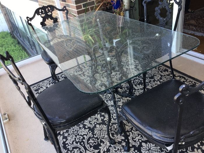 Vintage wrought iron glass table set with 4 matching chairs $485