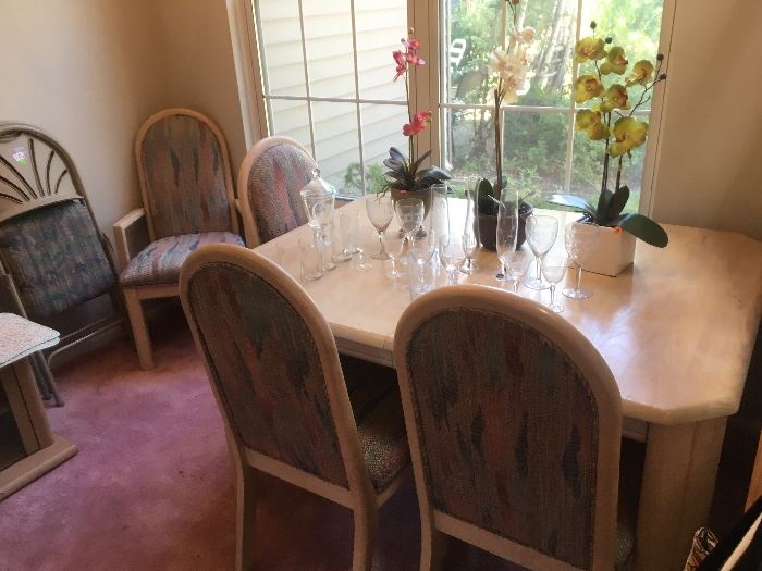 Light wood dining table, fabric chairs