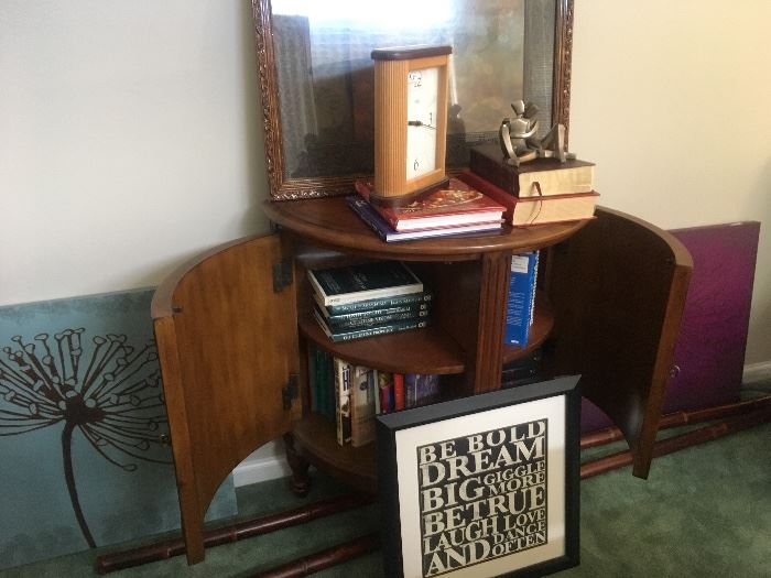 Artwork, cabinet, books