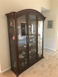 Beautiful large 3 door display cabinet with interior lighting! Imported from Italy by Bussandri! Features three front opening doors with locks and lighted inside too!