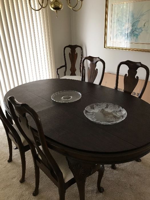 Well cared for and with pads! Includes 6 chairs, 4 are armless and 2 with arms. Plus 2 leafs!