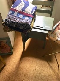 Large vintage wood school desk with a cat theme throw to keep you cozy