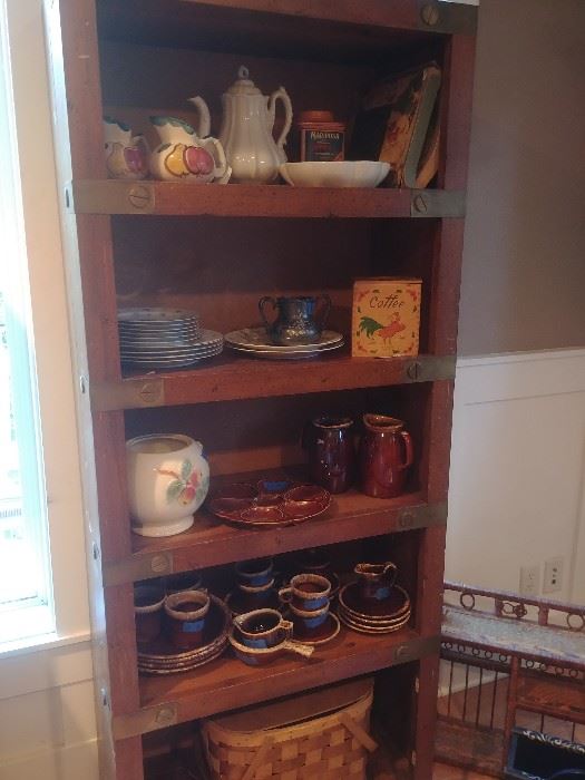 Many bookshelves, Purinton pottery, Hull, vintage picnic basket
