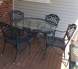 Aluminum glass top table with four chairs
