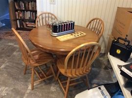 Oak pedestal table with four chairs