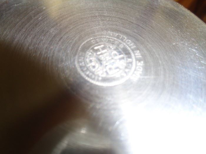 CLOSE UP VIEW OF SIGNED PEWTER OF DECANTERS
