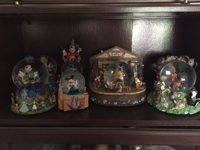 The Snow White and mickey snow globe to the left have both sold