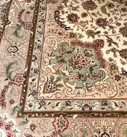 Oriental rug in ivory, sage and rust.