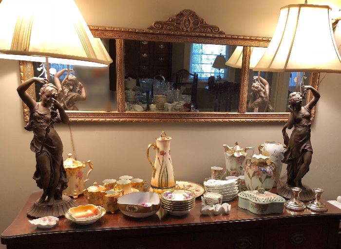 Large antique buffet with glass top. Gilt three-panel mirror. Pair of large bronze on spelter lamps. Limoges Pickard pieces, RS Prussia tea set. Limoges bone plates. Nippon
