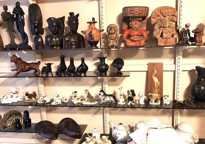 Carved wood figures, Greek amphora, Black pottery, porcelain dogs.
