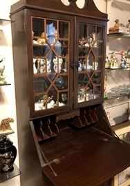 Secretary desk glass front cabinet.