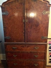 Art Deco chest, burled wood and ornate hardware.