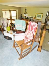 Rush seat rocker. Vintage textiles. Amazing antique cowbell.