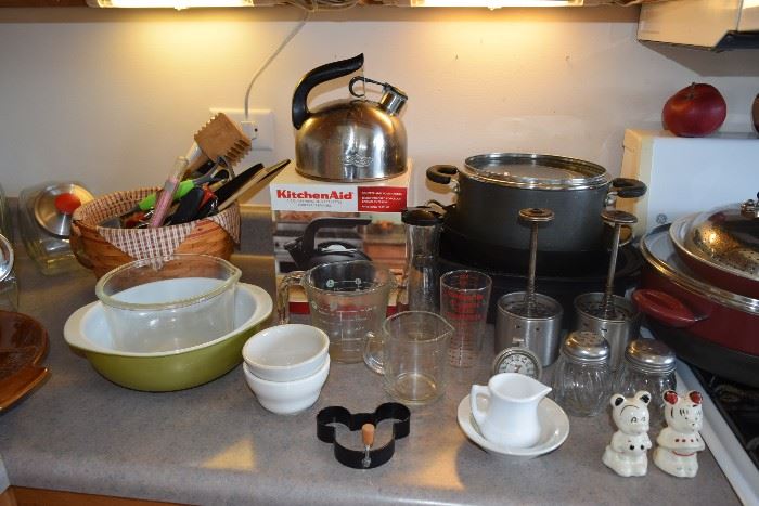 Pots and pans, measuring cups, tea pot, utensils