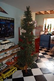 Artificial Christmas tree, collectible trucks