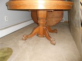 Large oak pedestal table with claw feet