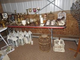 Lanterns, bird cages, brass candle sticks, vintage dress form