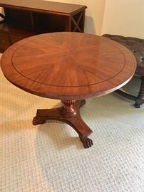 William Switzer French Empire pedestal table with carved lion's feet.  Olivewood top with Ebony filet. Made in Italy.   36D x 27.5H