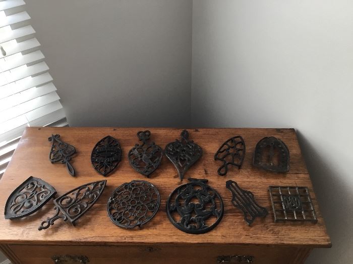 Antique trivets and stove grates. 
