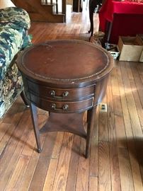 #32	(2) Leather-top 2 drawer round end tables  20x27  $120 each	 $240.00 
