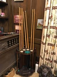 #85	7 Pool  Table Sticks on a stand 	 $50.00 
