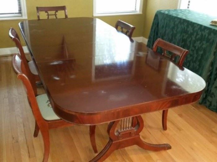 Mahogany dining table and chairs with lyre base