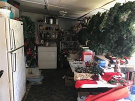 Back porch area - shows refrigerator, dryer, and lots of Christmas decorations