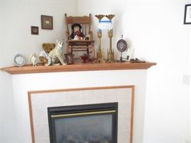 Child's rocker and a pair of decorative church candlesticks.