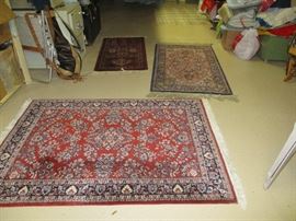No shortage of rugs in this basement