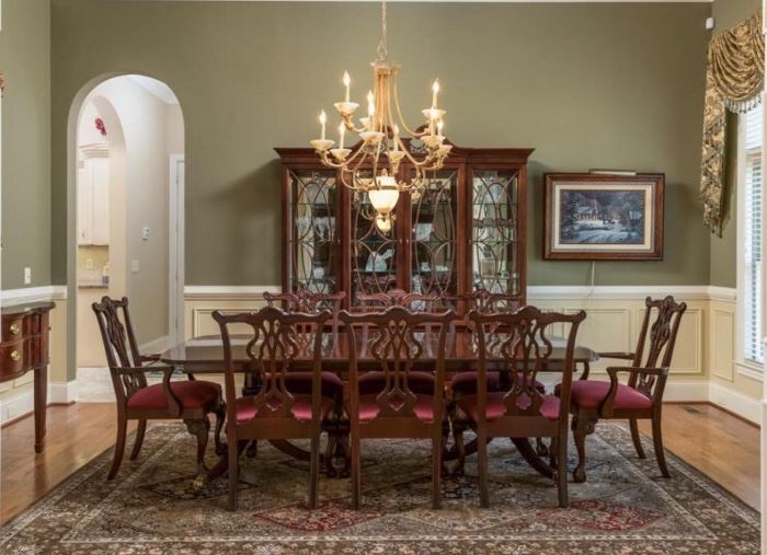 Side view of this glorious Thomasville Dining Room Table with 8 chairs includes two host chairs. and two inserts. Matching Thomasville Hutch includes 3 glass slotted shelves and one flat wood shelf, 5 drawers and two cabinets denotes style and elegance.  Very good buy on these incredible pieces. A must see! 