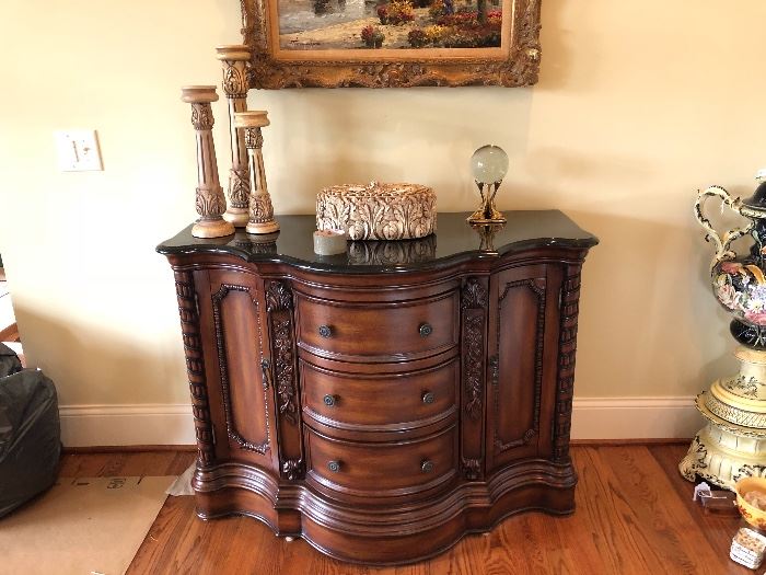 beautiful ornate marble top three drawer, two door console piece for any room of the house. 