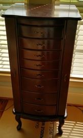 Upright  8 drawer Jewelry chest, 2 door with a pop up mirror