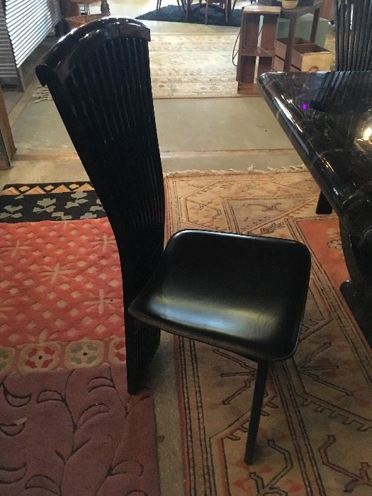 4 black leather Italian Designer chairs now $60 .00 each   . set $240...ouch !