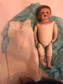 antique  bisque porcelain head Doll with jointed leather body