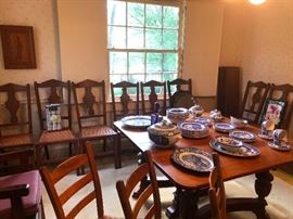 8 cane dining room chair, 2 Captains chair, Dining room Table includes 4 leaves! 