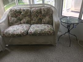 wicker loveseat + iron side table