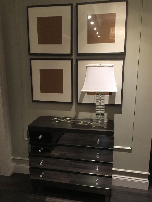 Glass cube lamp, set of four frames, mirrored chest of drawers